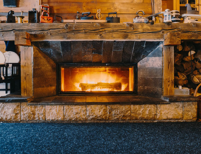 Fireplace and blue carpet