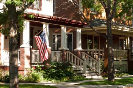 House exterior with porch and American flag